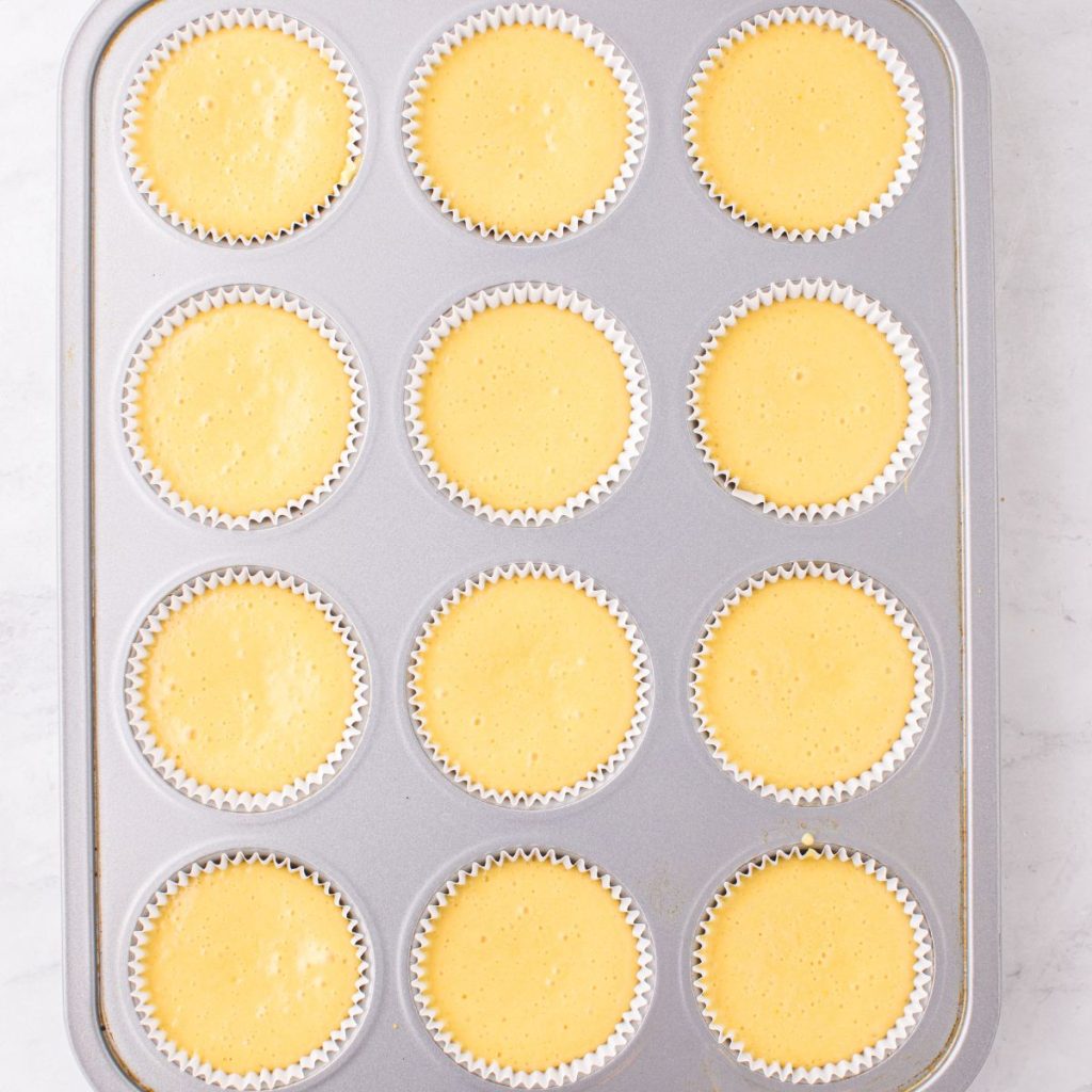 Muffin tin with cupcake batter. 