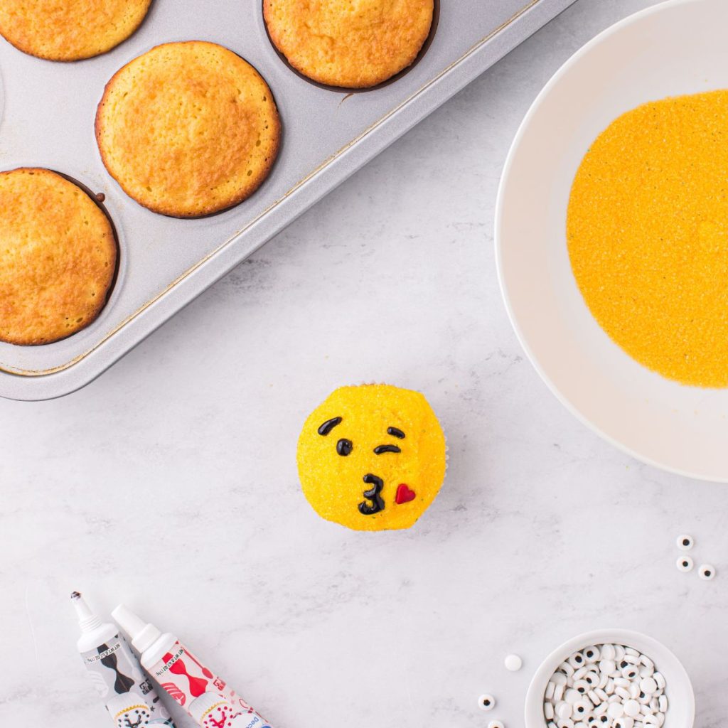 Emoji faced cupcake.