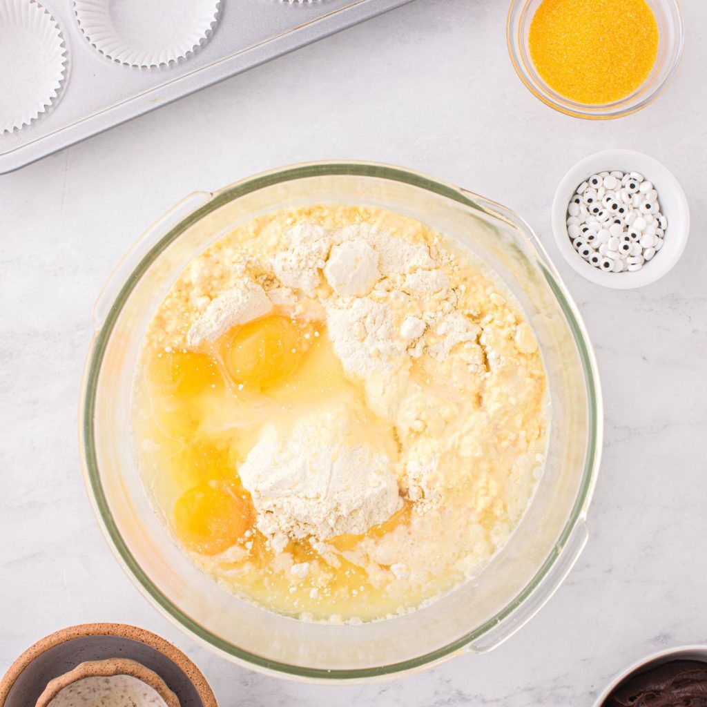 Bowl with cake mix and eggs. 