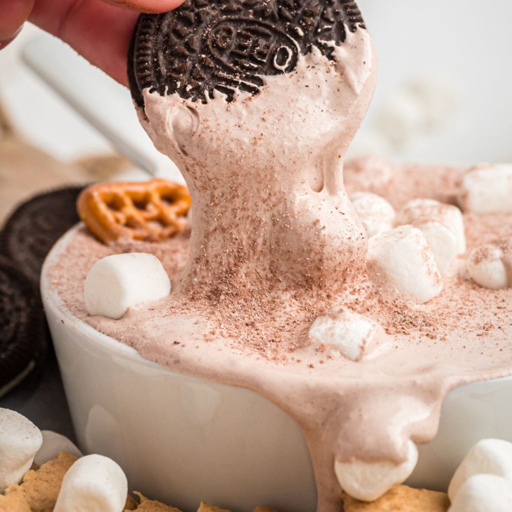 Oreo dipped in chocolate dip.