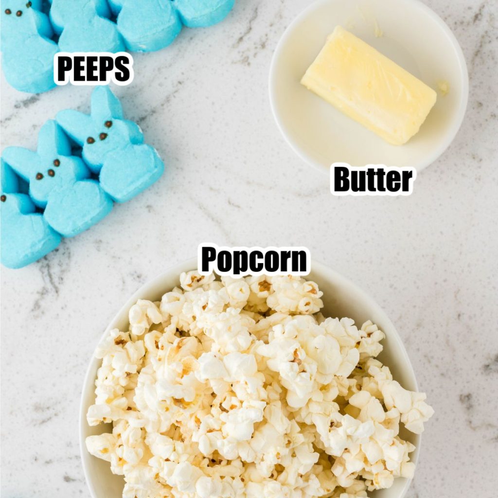 Bowl of popcorn, bowl of butter, and Peeps. 