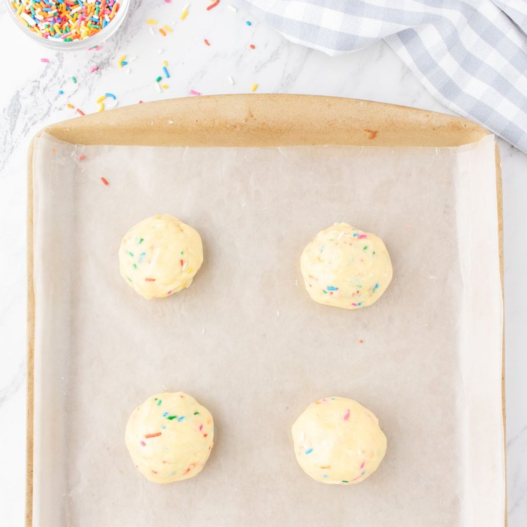 Dough balls on a baking sheet. 