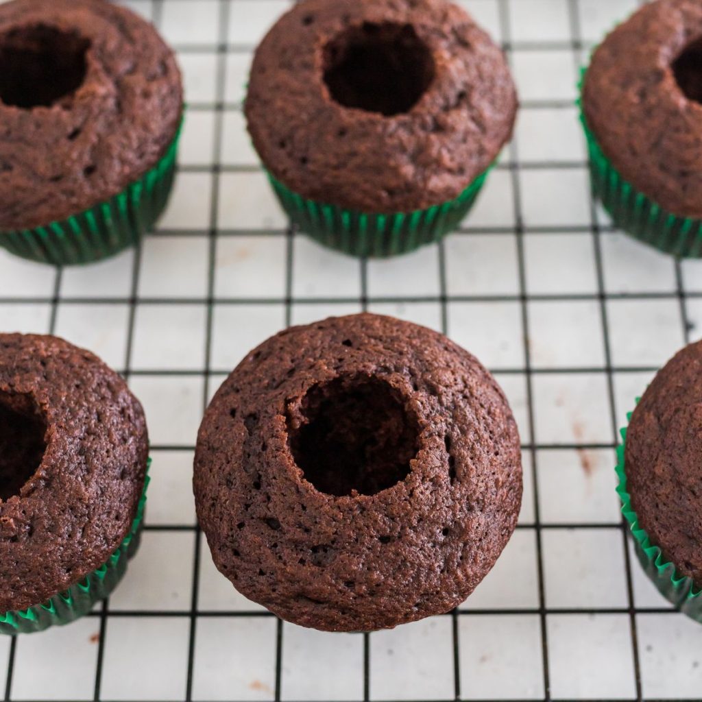 Chocolate cupcakes with a hole in the center.