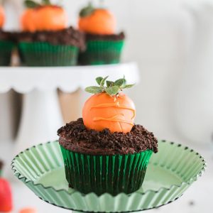 Chocolate cupcake with a chocolate covered strawberry that looks like a carrot.