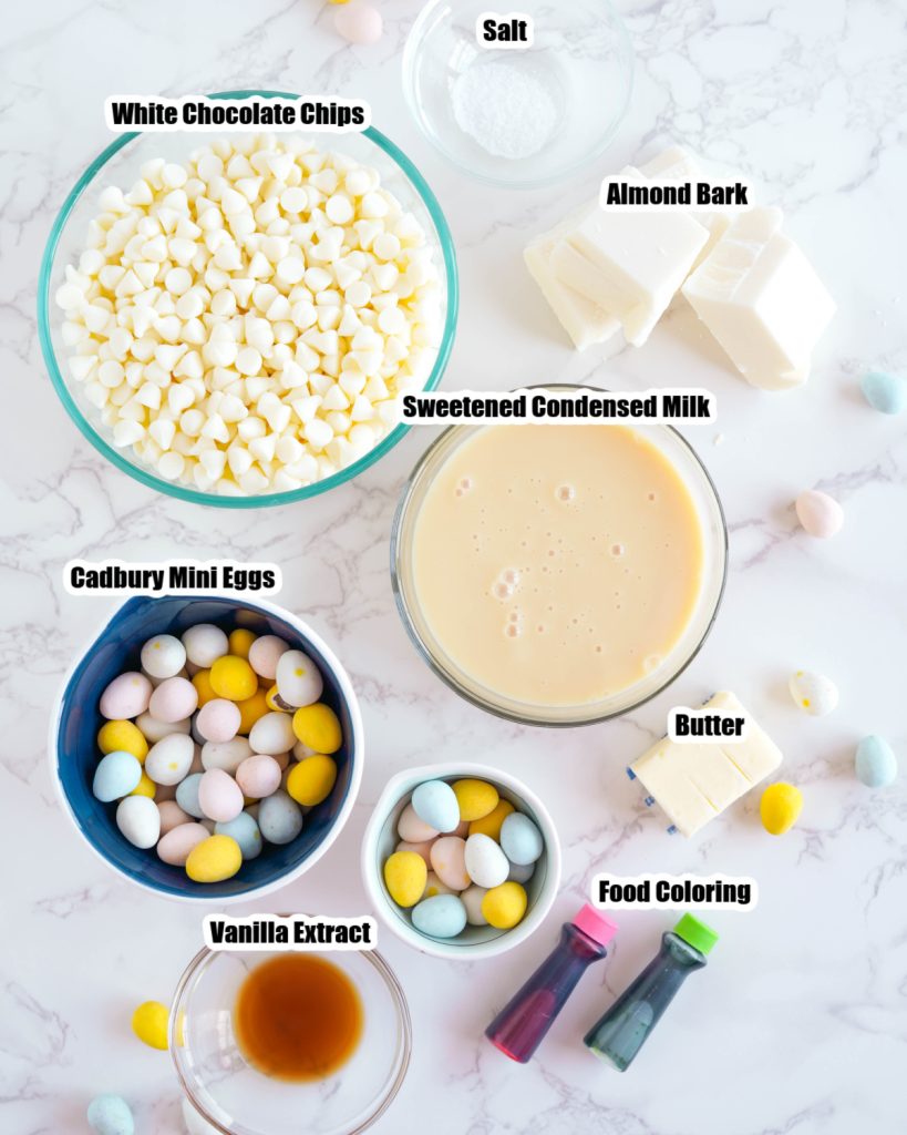 Bowl of white chocolate chips, sweetened condensed milk, candy chocolate eggs. 