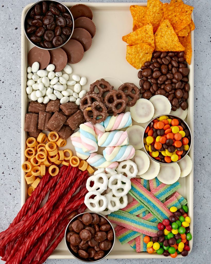 Tray with candy and chips. 