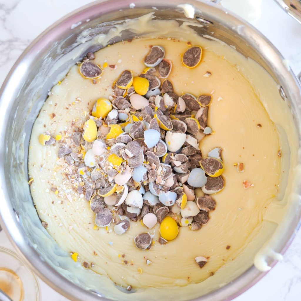 Bowl with white chocolate fudge and crushed chocolate egg candy. 