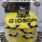 Yellow superhero cake with Batman.