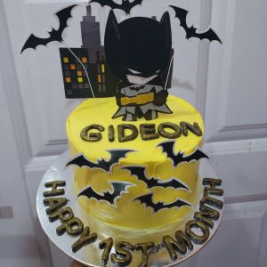 Yellow and black Batman birthday cake.