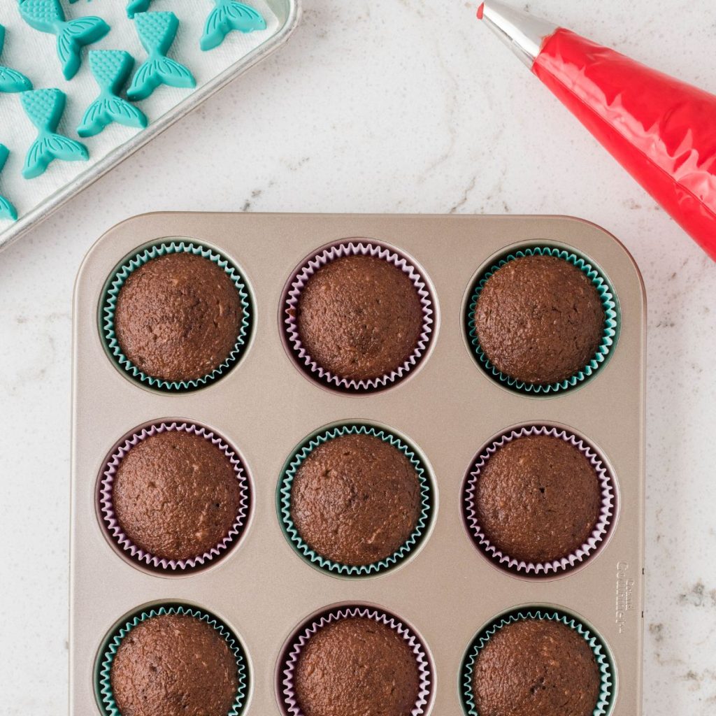 Chocolate cupcakes in a muffin tin. 