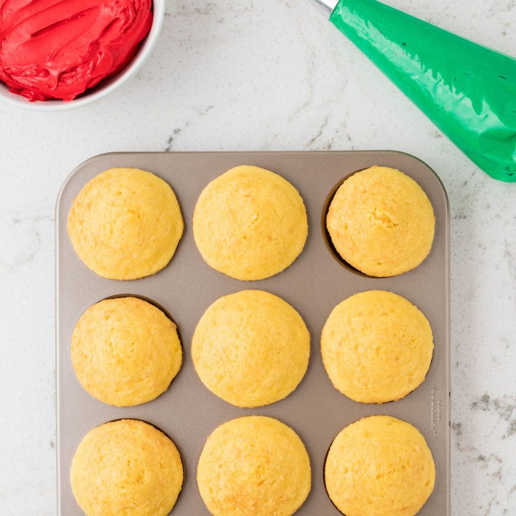 Yellow cupcakes in a tin. 