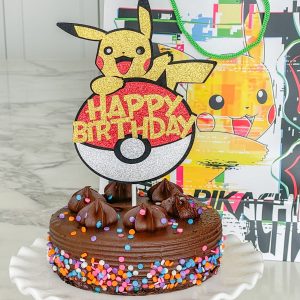 Chocolate cake with a Pokemon cake topper.