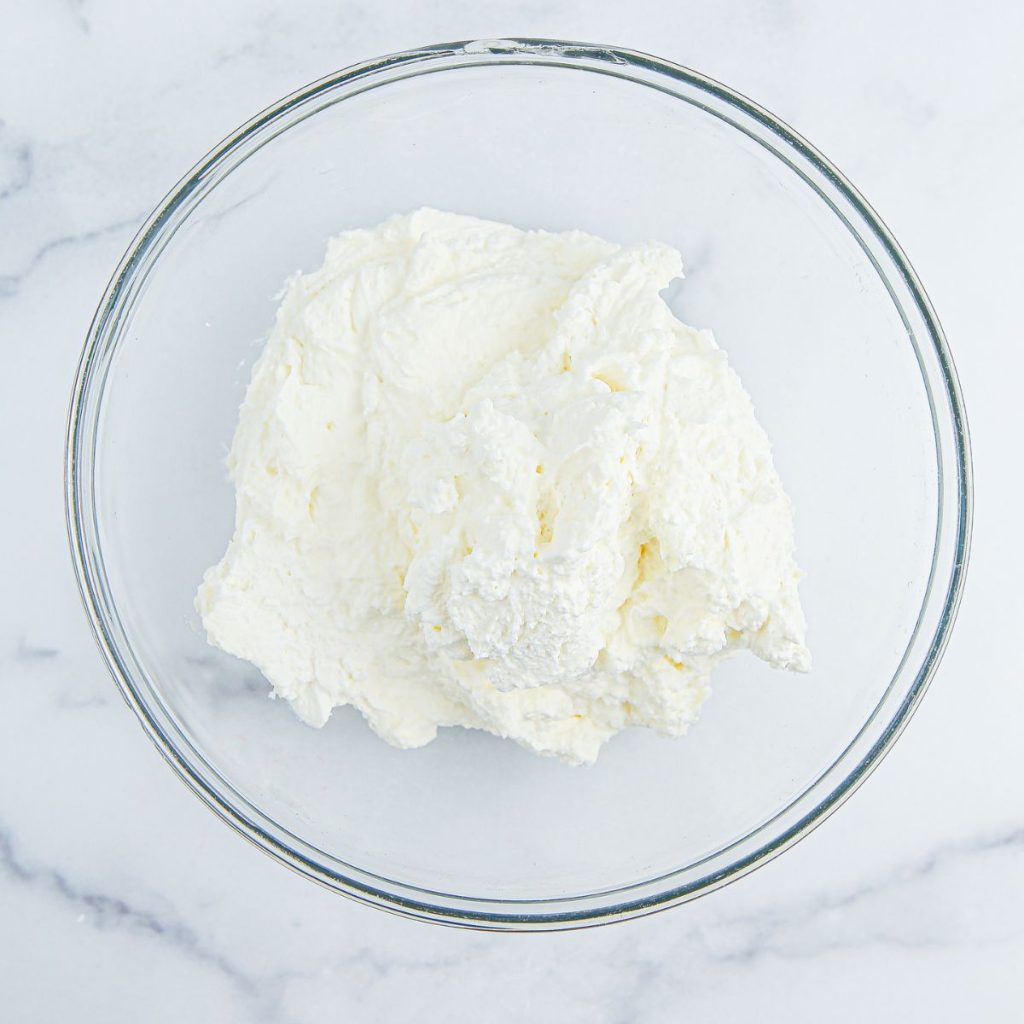 Whipped cream in a bowl. 