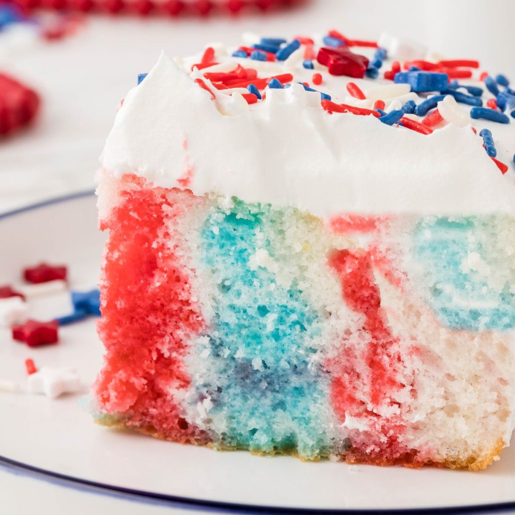 Red white and blue poke cake on a plate.