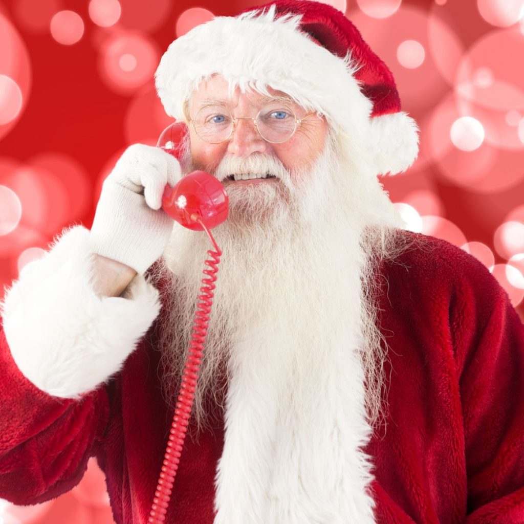 Picture of Santa Claus on the phone. 