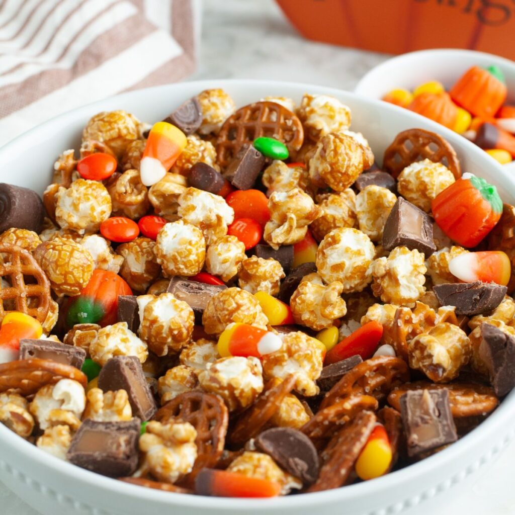 Bowl filled with fall snack mix. 