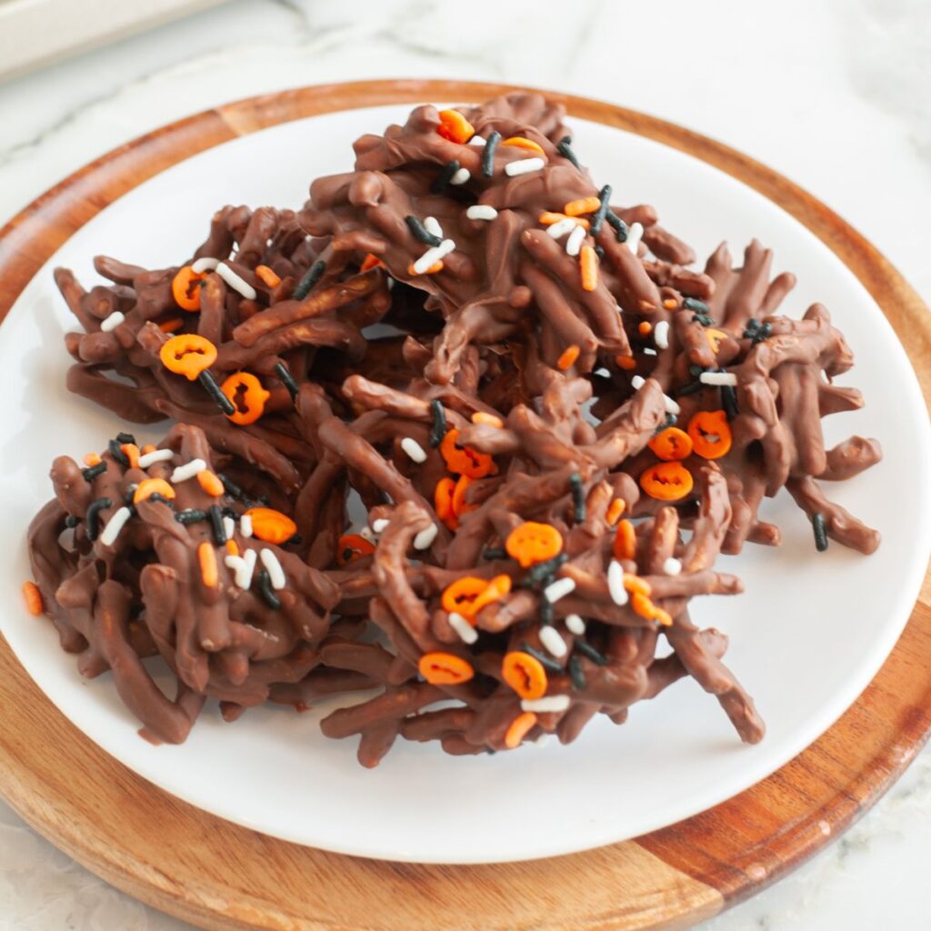 Plate of chocolate haystacks with Halloween sprinkles. 