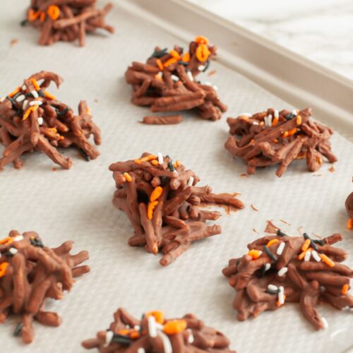 Chocolate haystacks on a baking sheet.