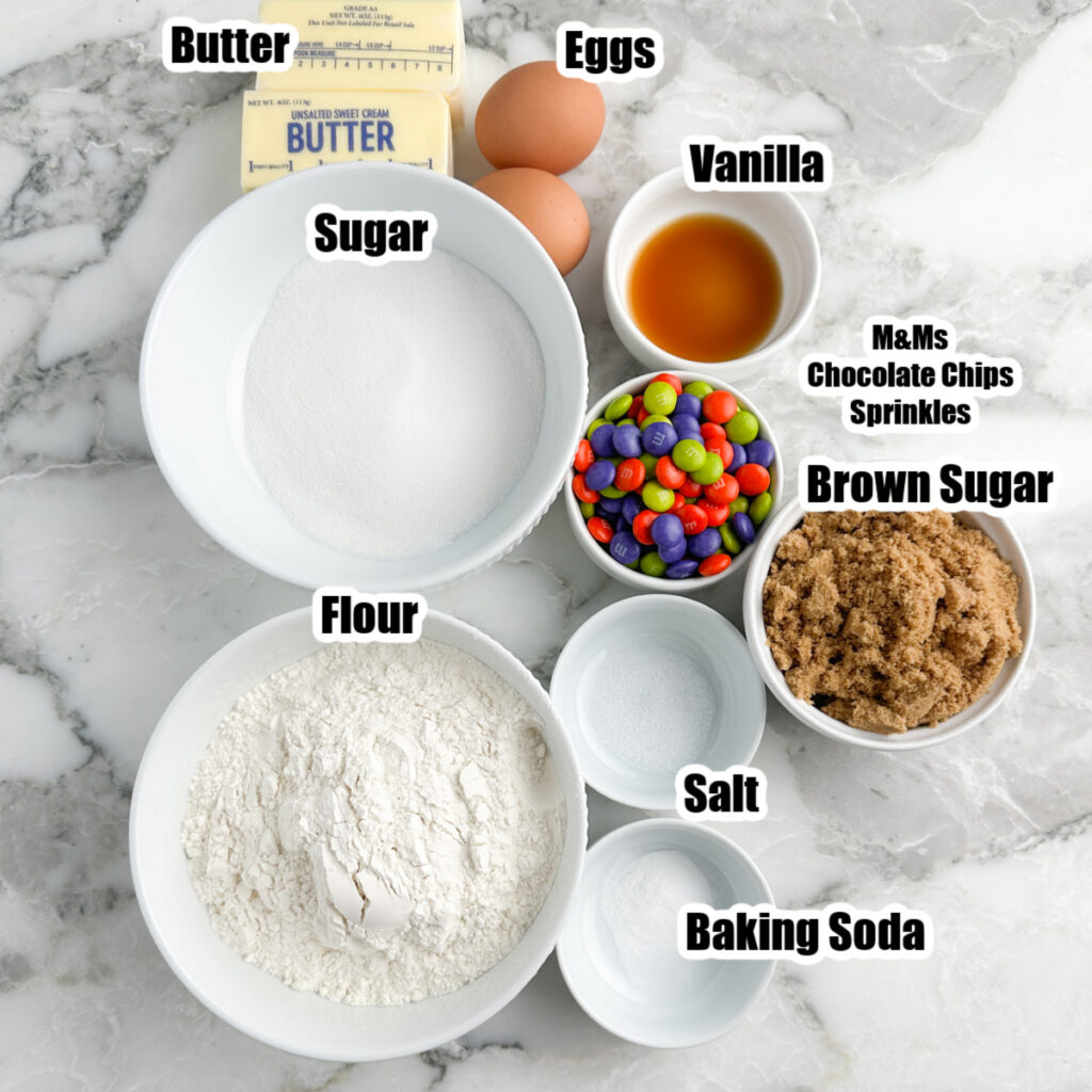 Bowl of sugar, flour, butter, eggs, candy, brown sugar, and baking soda.