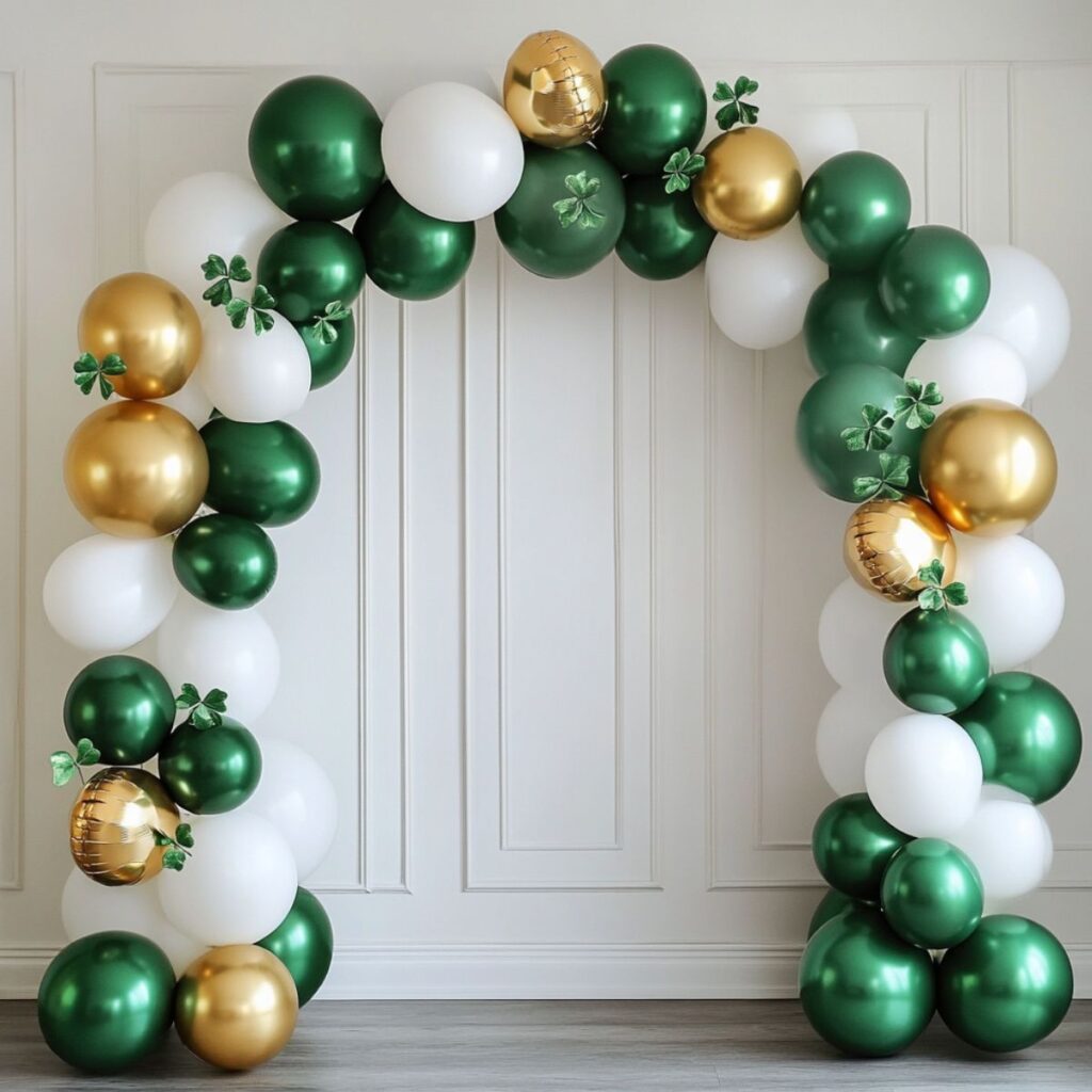 A green, gold, and white balloon arch. 