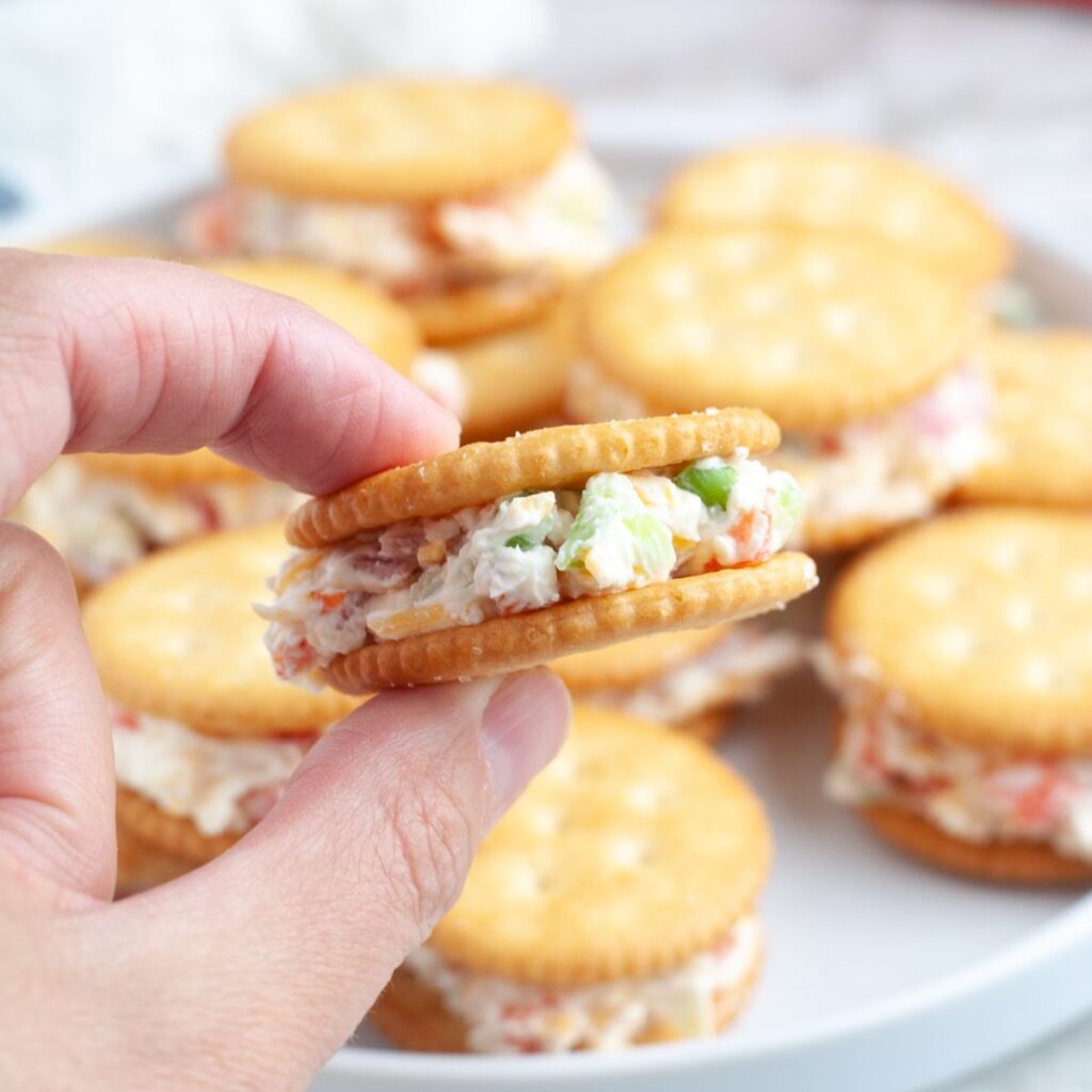 Hand holding crackers.