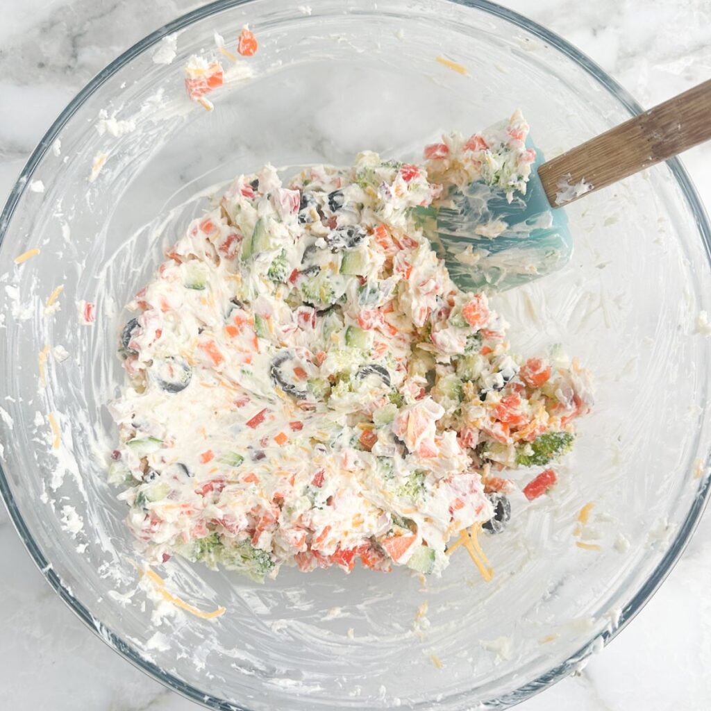 Bowl of cream cheese and vegetable mixture.