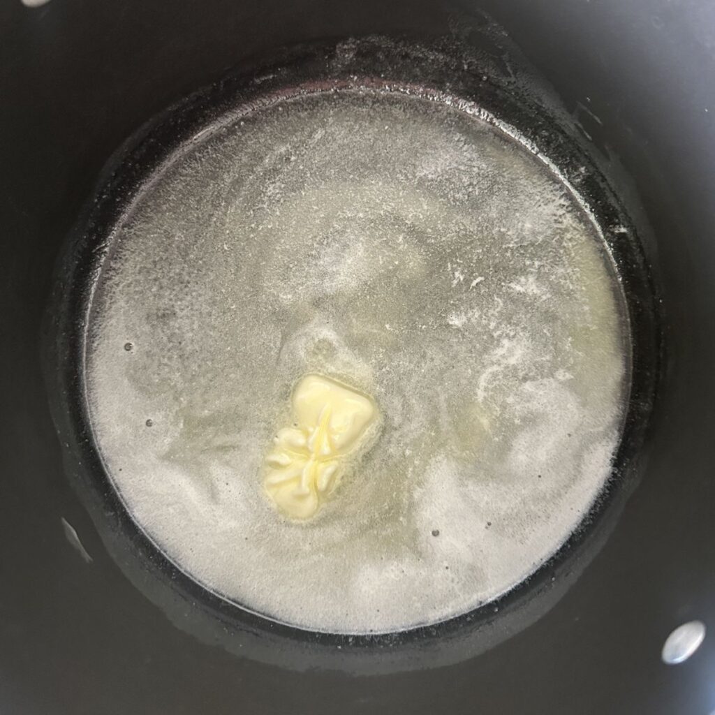 Pot with melted butter. 