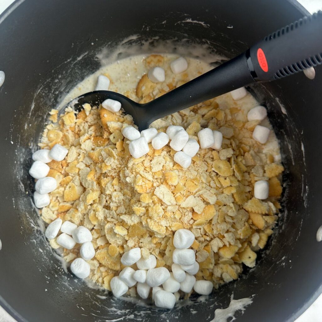 Pot with melted marshmallows and crushed Ritz crackers. 