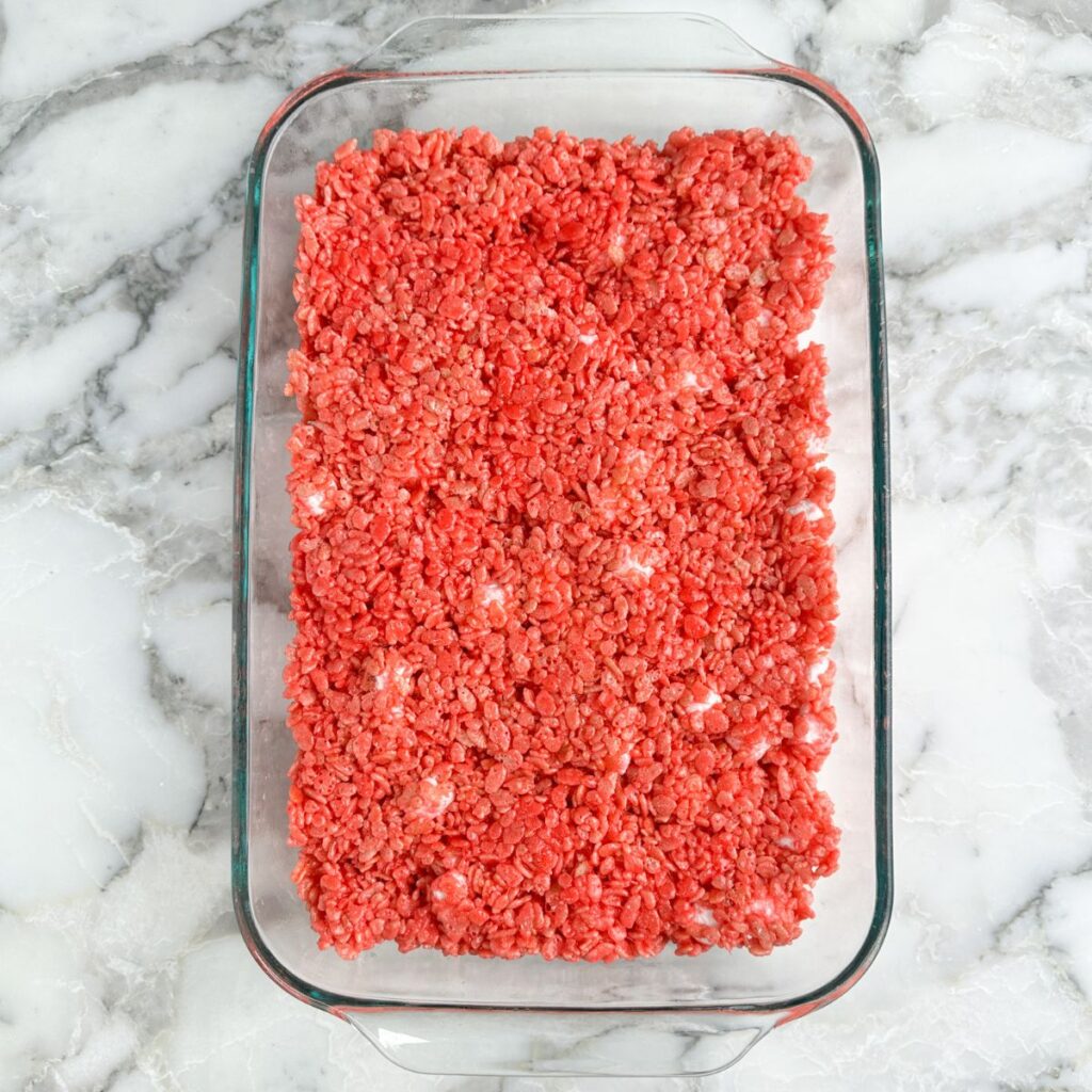 Baking dish with strawberry rice krispie treats. 