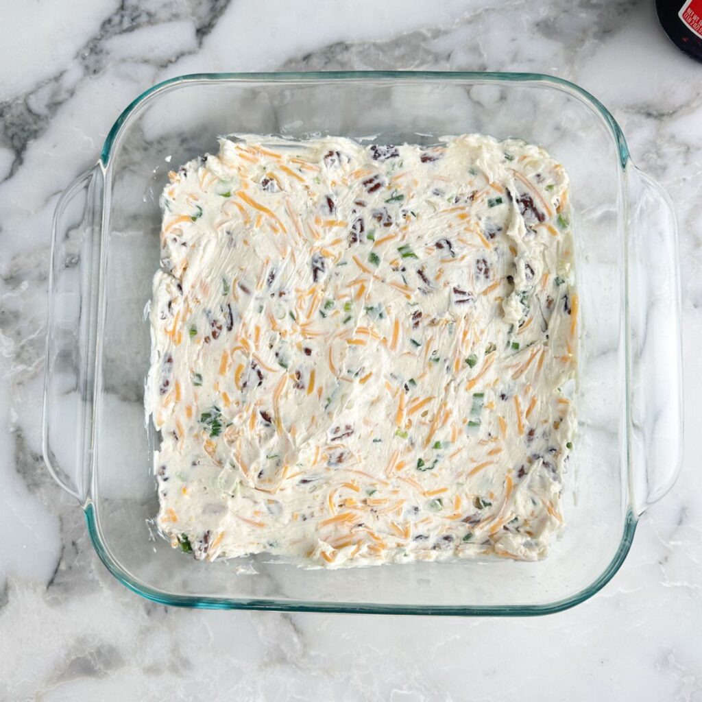 Baking dish with cream cheese dip. 