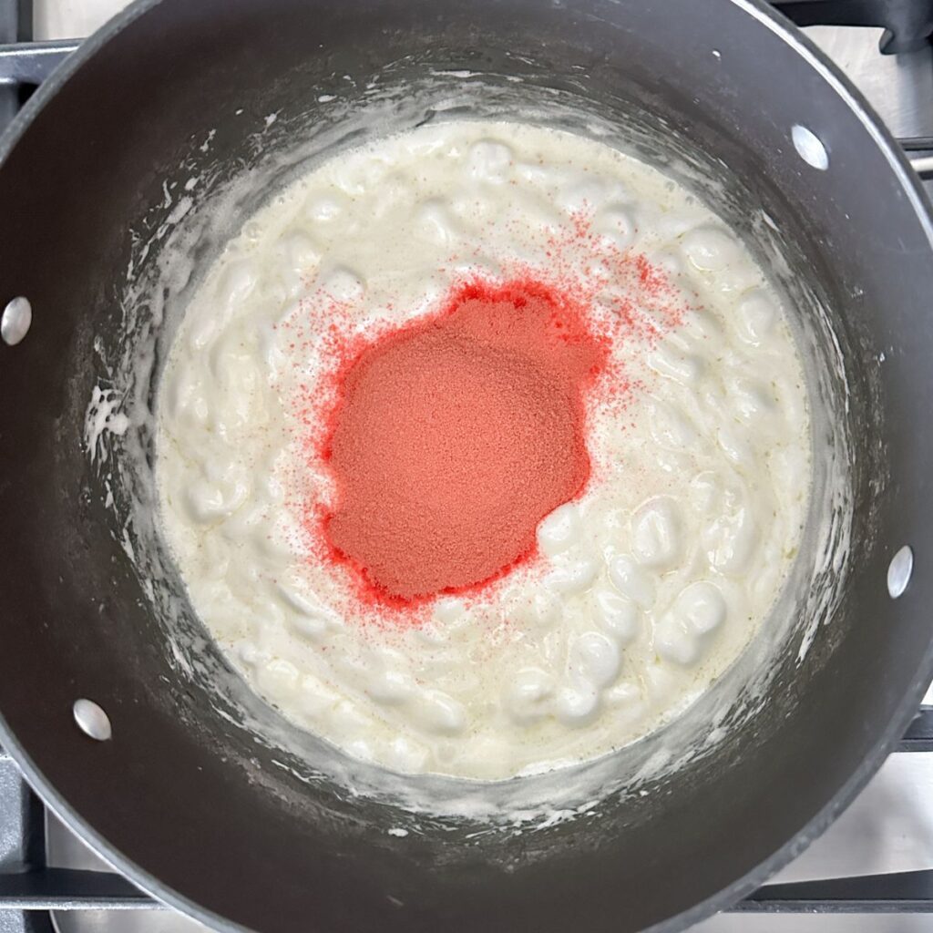 Pot with melted marshmallows and JELL-O powder. 
