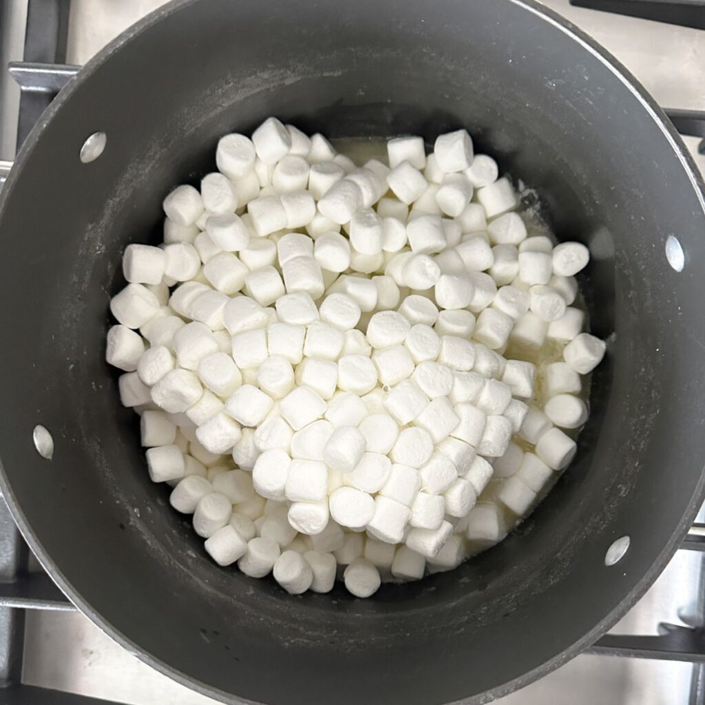 Pot with melted butter and mini marshmallows.