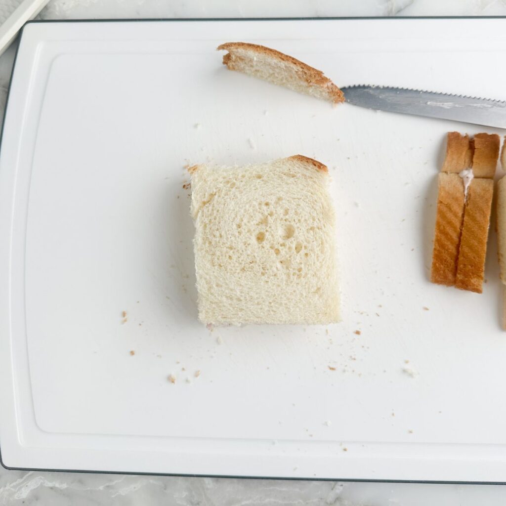 Strawberry sandwich with crust cut off. 